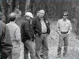 Staff and guests meeting outdoors